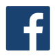 Un quadrato blu con una “f” minuscola bianca al centro, che rappresenta il logo di Facebook.