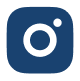 Un'icona quadrata blu con angoli arrotondati, con al centro un cerchio bianco e in alto a destra un puntino bianco più piccolo, che ricorda una fotocamera stilizzata o il logo di Instagram.